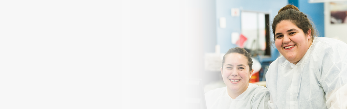 Two smiling medical professionals